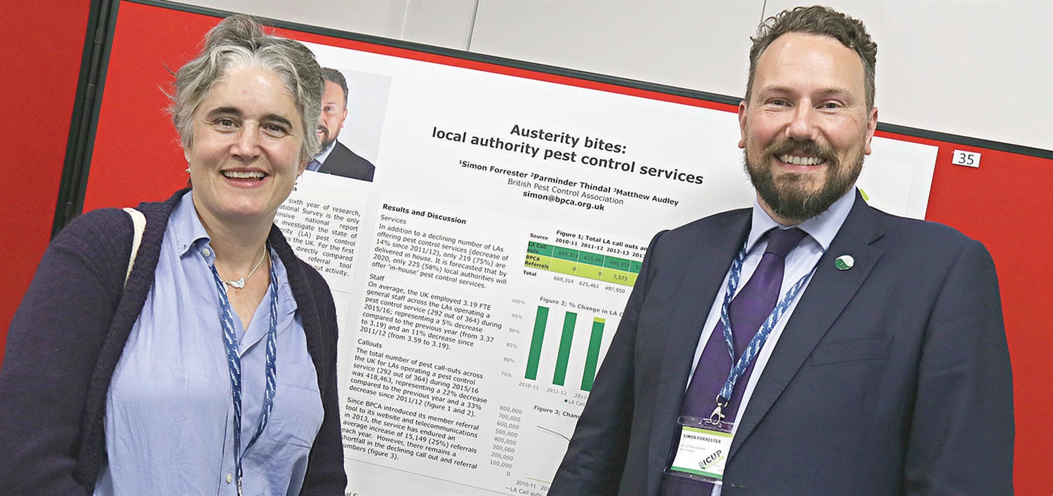 Imogen Levenson from Tufnell Park Pest Control with Simon admiring our poster